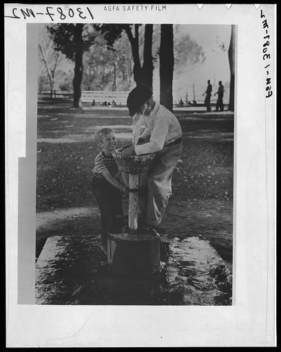 Fun at the water fountain, picnic grounds. Vale, Oregon