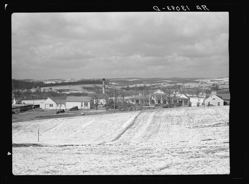 View on Arthurdale project, Reedsville, West Virginia, showing community center, shops, and administration buildings