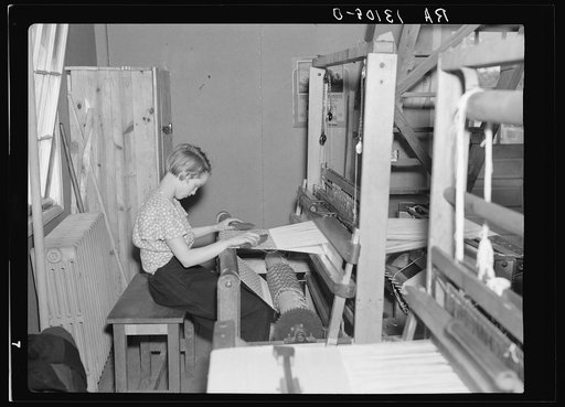 Arthurdale homesteader weaving in the cooperative looms of Reedsville, West Virginia