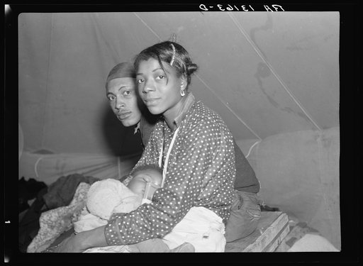 Three refugees from the 1937 flood in their tent of the camp in Marianna, Arkansas