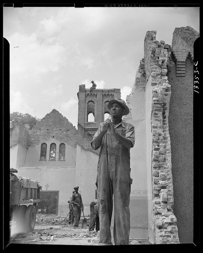 Washington, D.C. Construction workman wrecking a church on Independence Avenue