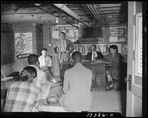 Washington, D.C. Air raid wardens' meeting in zone nine, Southwest area. Elmer House, federal worker by day and on air raid duty at night, outlining plans for his sector