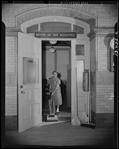 Washington, D.C. Charwoman cleaning after regular working hours at the Office of the Registrar of the Treasury