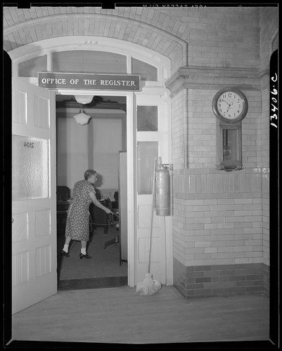Washington, D.C. Charwoman cleaning after regular working hours at the Office of the Registrar of the Treasury