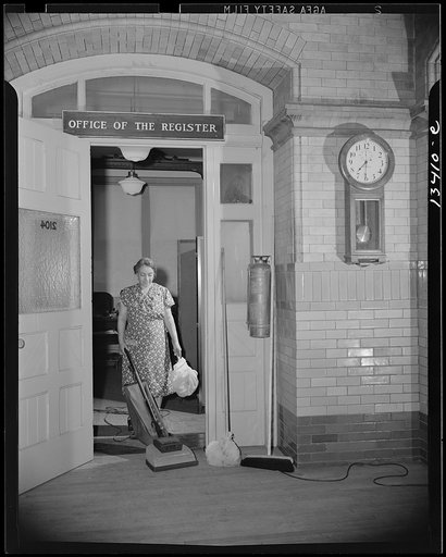 Washington, D.C. Government charwoman cleaning after regular hours