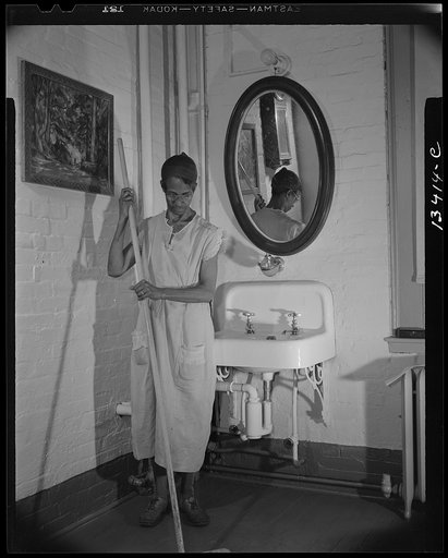 Washington, D.C. Government charwoman who provides for a family of six on her salary of one thousand and eighty dollars per year. She has been a federal employee for twenty-six years