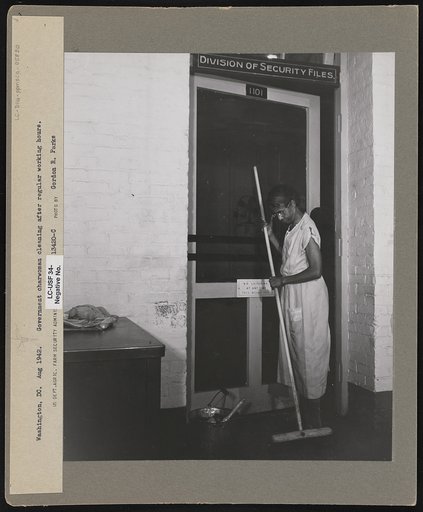 Washington, D.C. Government charwoman cleaning after regular working hours