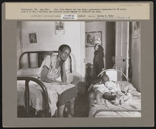 Washington, D.C. Mrs. Ella Watson, who has been a government charwoman for twenty-six years, with three of the five children she supports on her salary of one thousand eighty dollars per year