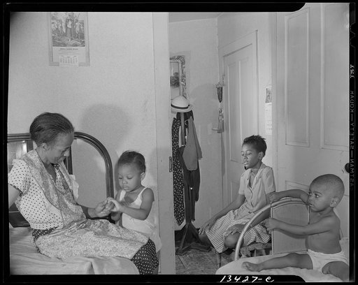 Washington, D.C. Adopted daughter and two grandchildren with Mrs. Ella Watson, a government charwoman