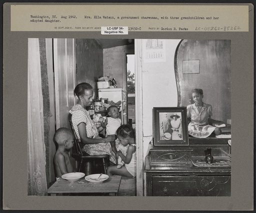 Washington, D.C. Mrs. Ella Watson, a government charwoman, with three grandchildren and her adopted daughter
