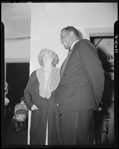 Washington, D.C. Russian war anniversary benefit at the Watergate. Madame Litvinoff, wife of the Russian Ambassador, backstage with Paul Robeson