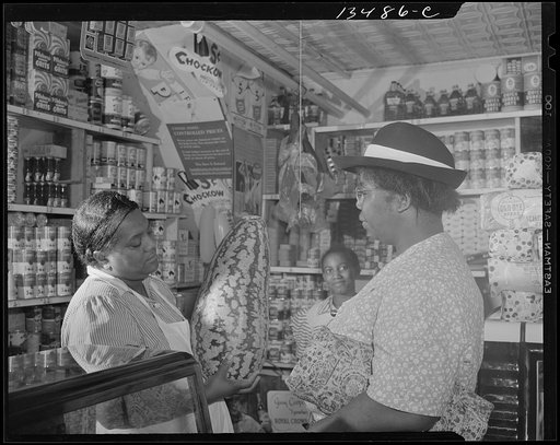 Washington, D.C. Housewife bargaining in the store owned by Mr. J. Benjamin