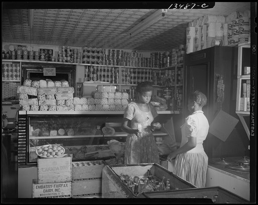 Washington, D.C. Mr. J. Benjamin's daughter waiting on a customer in her father's store