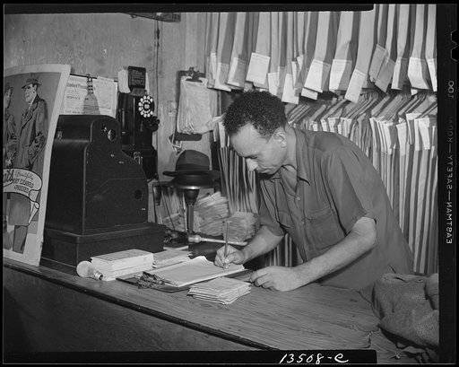 Washington, D.C. A tailor in Frank's cleaning and pressing establishment checking over the days intake