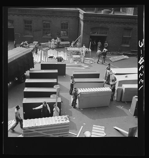 Washington, D.C. United States government workers and carpenters making crates for steel cabinets and preparing them for shipment in the rear of the Auditor's Building at 14th Street and Independence Avenue