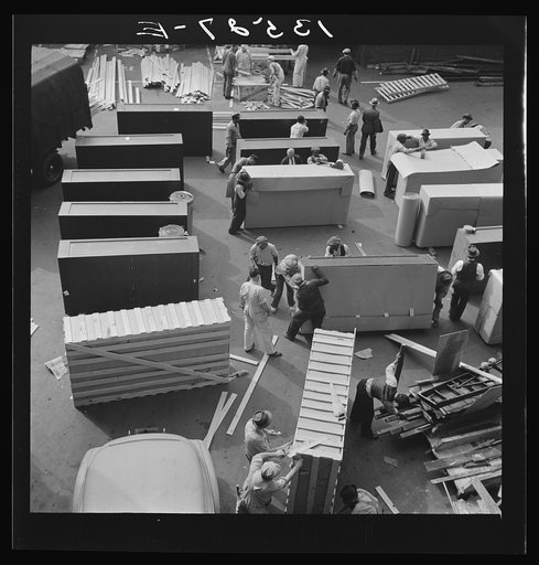 Washington, D.C. United States government workers and carpenters making crates for steel cabinets and preparing them for shipment in the rear of the Auditor's Building at 14th Street and Independence Avenue