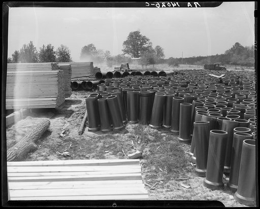 General building material. Tile pipes and lumber. Berwyn, Maryland