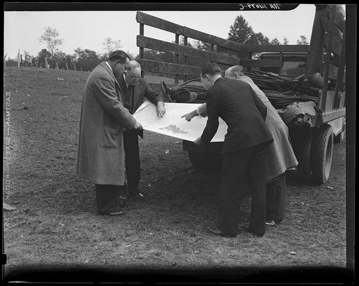 Officials examining plan of Greenbelt, Maryland