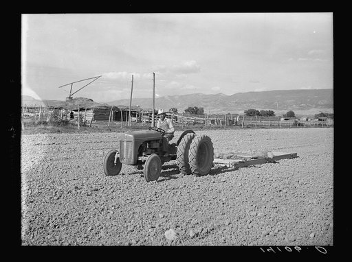 This new heavy tractor is owned by the Hansen-Frederickson Machinery Cooperative of Sanpete County, Utah. Mariel O. Hansen drives the tractor purchased with the aid of a Farm Security Administration Community and Cooperative Service loan