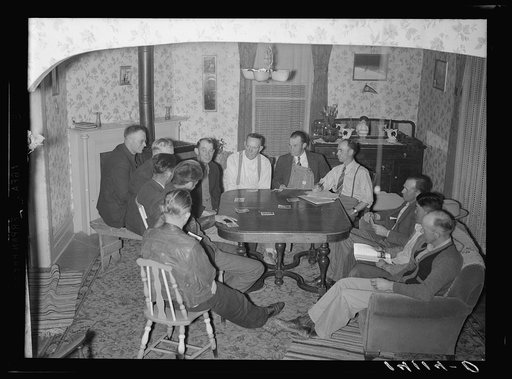 A night meeting of members of the West Corinne Cooperative Bull Association. This is a thriving sire service, set up with a Farm Security Administration community and cooperative service loan among farmers of Box Elder County, Utah
