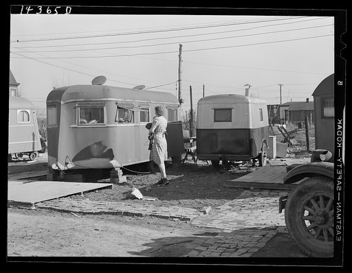 Wife of torpedo plant worker talks with her neighbor. Trailer camp in Alexandria, Virginia