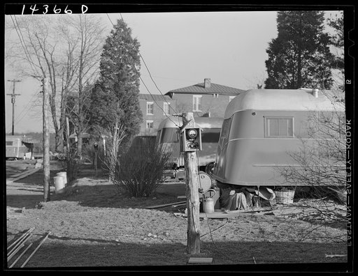 Each family in trailer has own electric meter box. Trailer camp on U.S. 1 outside of Alexandria, Virginia