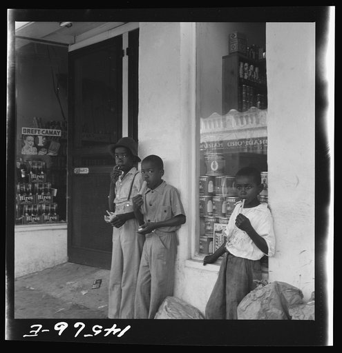 Negro boys eating popsicles. At Starke, Florida