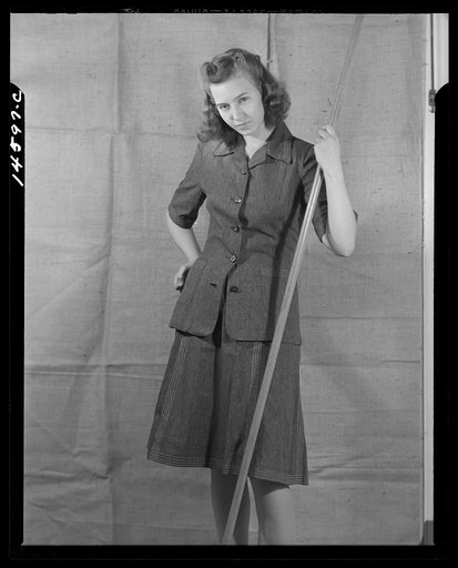Washington, D.C. Modeling denim dress worked out for a high school girl on a low income by graduate students of the Department of Clothing and Textiles, School of Home Economics, University of Alabama