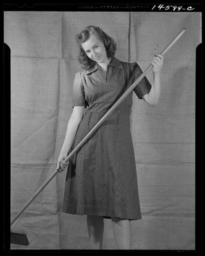 Washington, D.C. Modeling blue dress made from sugar sacks worked out for a high school girl on a low income by graduate students of the Deptartment of Clothing and Textiles, School of Home Economics, University of Alabama. Total cost of materials was three dollars and eighteen cents
