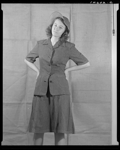 Washington, D.C. Modeling denim dress and hat worked out for a high school girl on a low income by graduate students of the Department of Clothing and Textiles, School of Home Economics, University of Alabama