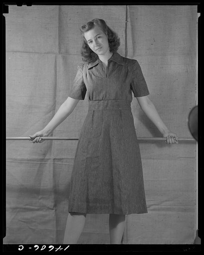Washington, D.C. Modeling blue dress made from sugar sacks worked out for a high school girl on a low income by graduate students of the Department of Clothing and Textiles, School of Home Economics, University of Alabama. Total cost of materials was three dollars and eighteen cents