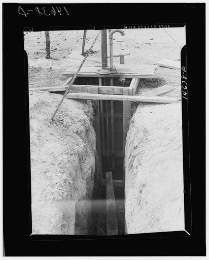 Milaca, Minnesota. Well pit eliminated by installation of pipe and water pump