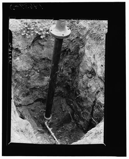 Milaca, Minnesota. Well pit eliminated by installation of pipe and water pump