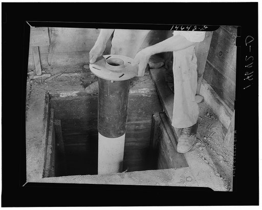 Milaca, Minnesota. Well pit eliminated by installation of pipe and water pump