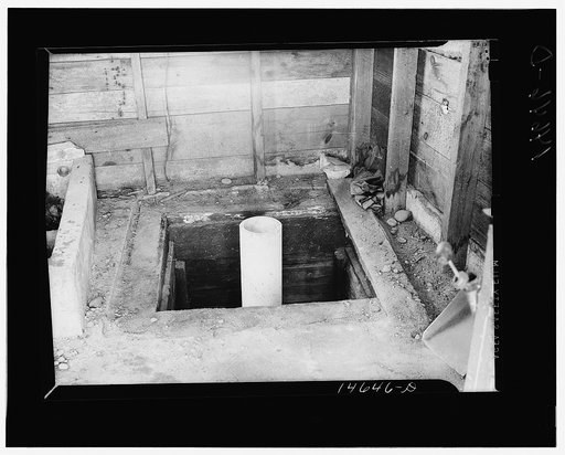 Milaca, Minnesota. Well pit eliminated by installation of pipe and water pump