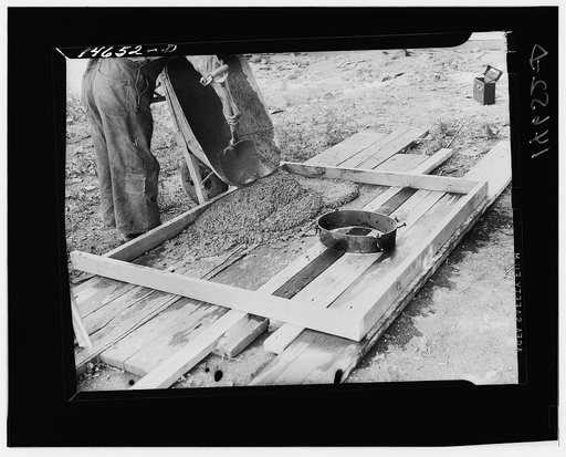 Collar for cast iron stool placed in form for sanitary privy slab. Minnesota