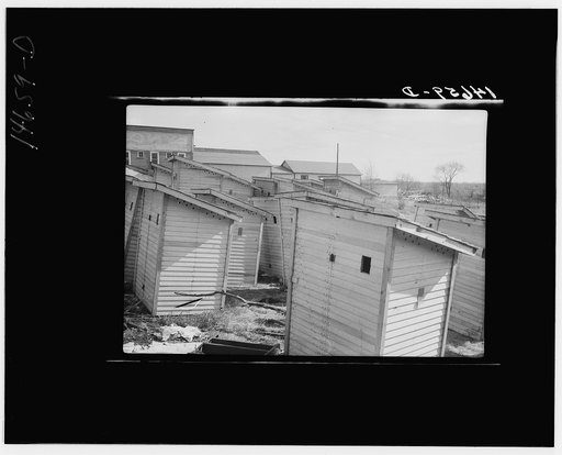 Buildings for new sanitary privies constructed in central yard for environmental sanitation program in Minnesota