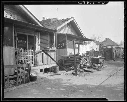 Untitled photo, possibly related to: Mexican quarter of Los Angeles, California. Average rental is eight dollars. Some houses have plumbing. See card 1799-C for detailed information