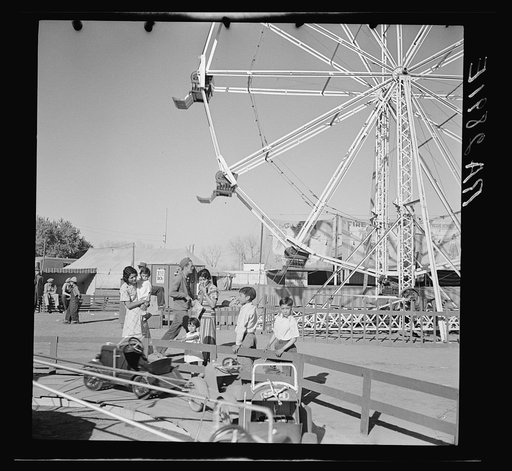 Untitled photo, possibly related to: Watching the amusements. Carnival at Roswell, New Mexico