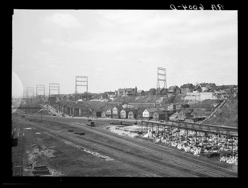 Untitled photo, possibly related to: Milwaukee freight yards and industrial plants overshadowed by residential district. Milwaukee, Wisconsin