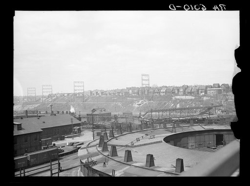 Untitled photo, possibly related to: Milwaukee freight yards and industrial plants overshadowed by residential district. Milwaukee, Wisconsin