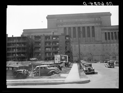 Untitled photo, possibly related to: Rear of apartment house showing new Milwaukee courthouse in background. Wisconsin