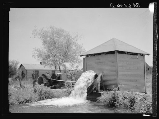 Untitled photo, possibly related to: An electric pump, one of the newest type water pumps in Arkansas. Rice farming business near Harrisburg. This farm figures expenses of sixty dollars a day, covering everything from electricity to labor, from the day of tilling the soil until the reaping of the ri