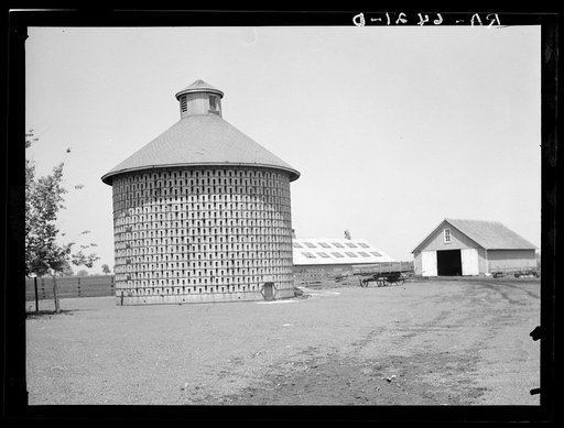 Untitled photo, possibly related to: Corn crib of concrete blocks, capacity 7000 bushels, harvest of 140 acres. Central Illinois