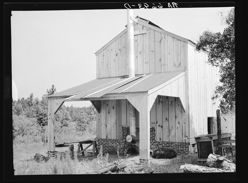 Untitled photo, possibly related to: Flue cure tobacco barn on Irwinville Farms, Rural Resettlement Administration project at Irwinville, Georgia