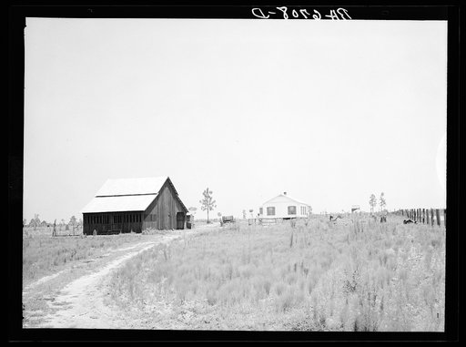 Untitled photo, possibly related to: "Bryan" barn on rural resettlement farm unit in Irwinville Farms, Georgia. This barn, designed and built under supervision of W.P. Bryan, project manager, cost one hundred forty-five dollars. This compared with the cost of three hundred fifty dollars of Rural Res