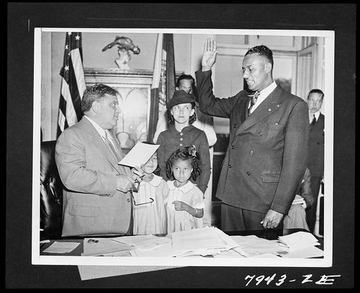 Untitled photo shows: Mayor La Guardia swearing in Justice Myles Paige