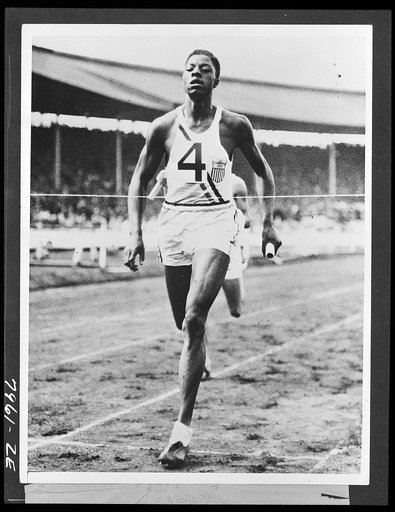 Untitled photo shows: John Woodruff #4 running in the two mile relay race at the Olympics, 1936 August 15