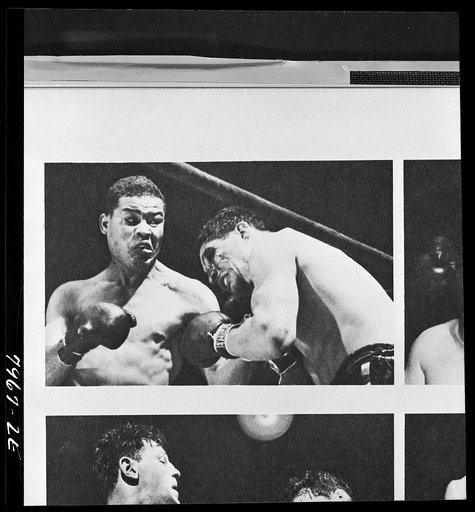 Untitled photo shows: Joe Louis lands a punch against Arturo Godoy during the fight at Yankee Stadium, Bronx, New York.