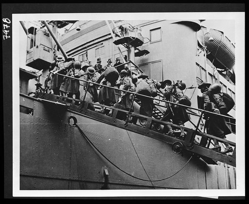 Untitled photo shows: Soldiers in full pack boarding a transport